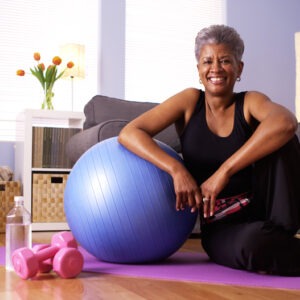 Woman with exercise equipment; home workout