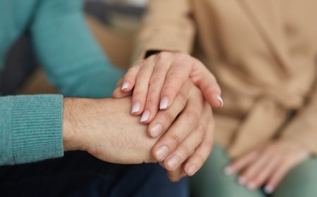 Support of friend holding hand